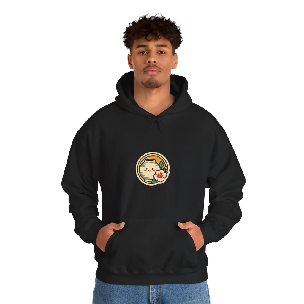 Man in a black hoodie with a round badge print on the chest