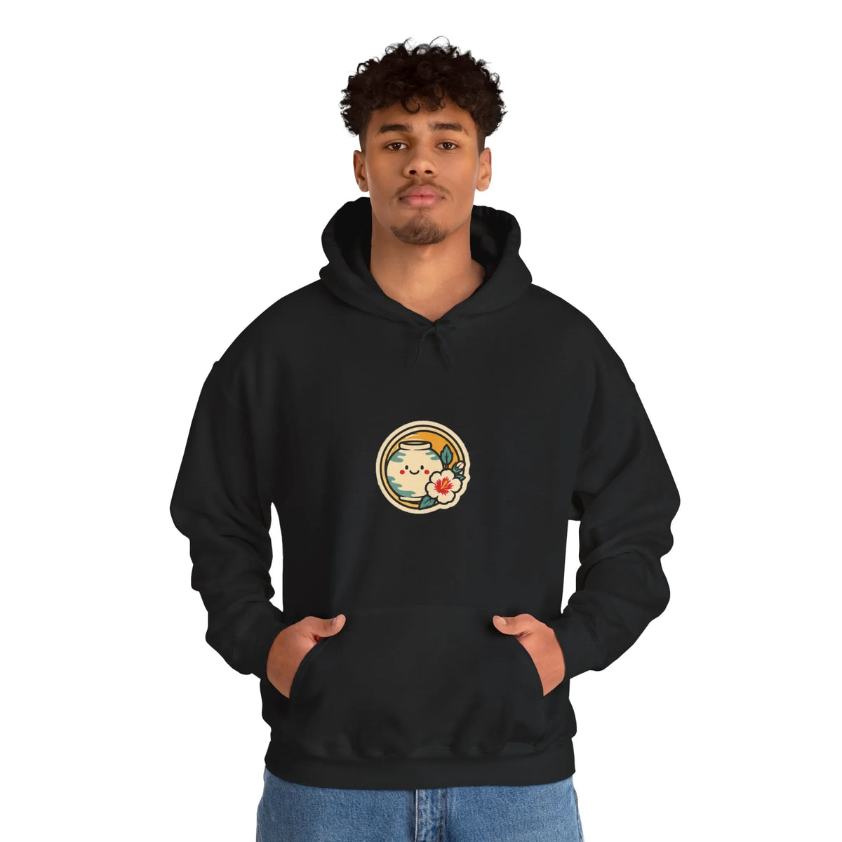 Man in a black hoodie with a round badge print on the chest