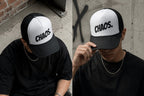 Model wearing CHAOS cap, close-up detail