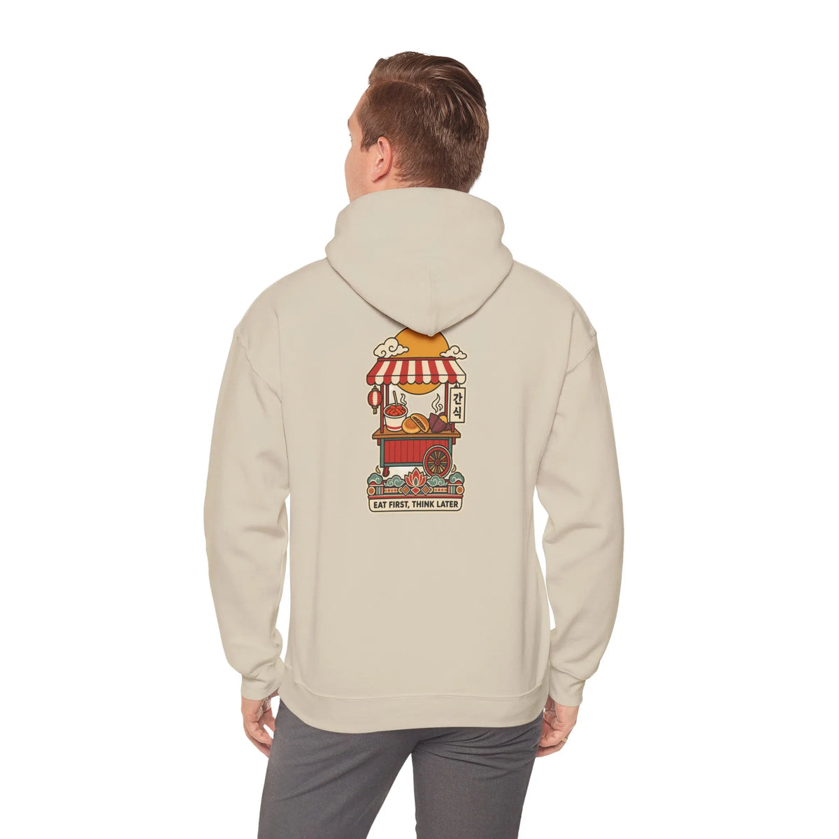 Back view of a beige hoodie with a Korean street food cart print, worn by a man