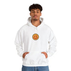 Man in an off-white hoodie with a small smiley face print on the chest