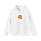 Front of an off-white hoodie with a small smiley face print