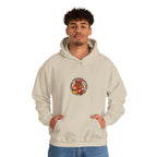 Man wearing a beige hoodie with a small lucky pouch badge on the chest