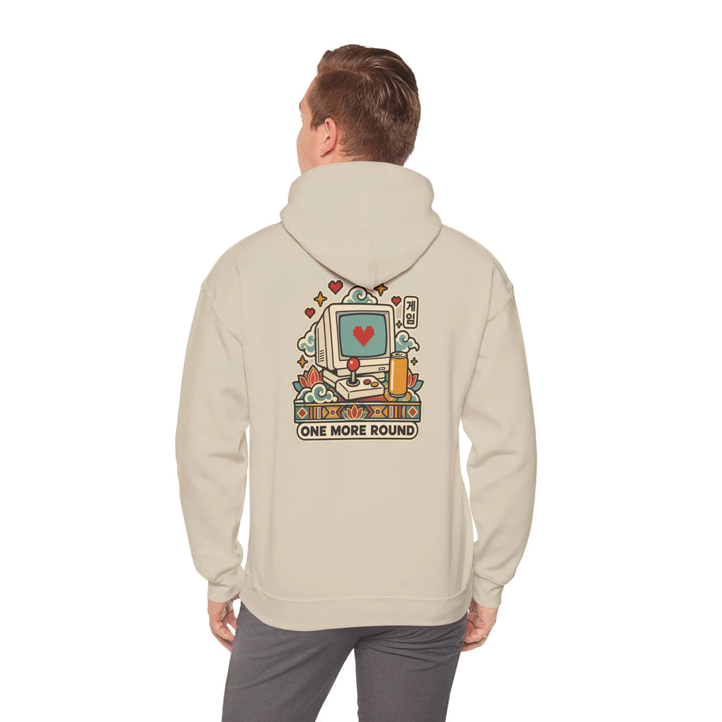 Back view of a beige hoodie with a late-night gaming graphic, worn by a man