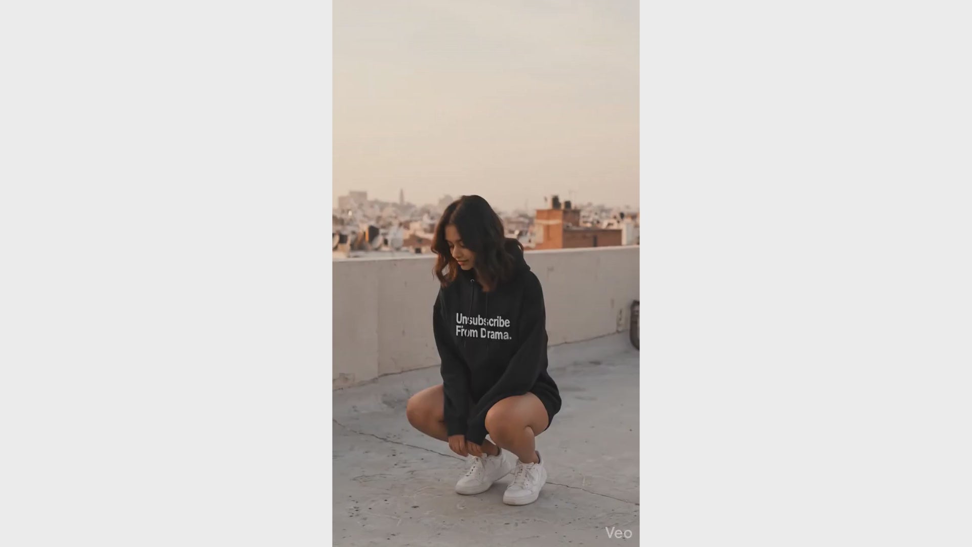 A girl showing off Unsubscribe Hoodie 