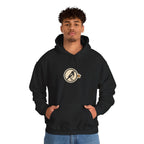 Man in a black hoodie with a small round athletic badge on the chest