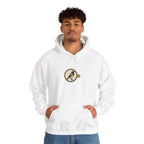 Man in an off-white hoodie with a small round athletic badge on the chest