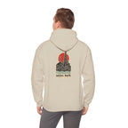 Back view of a beige hoodie with a Seoul skyline and coordinates print, worn by a man