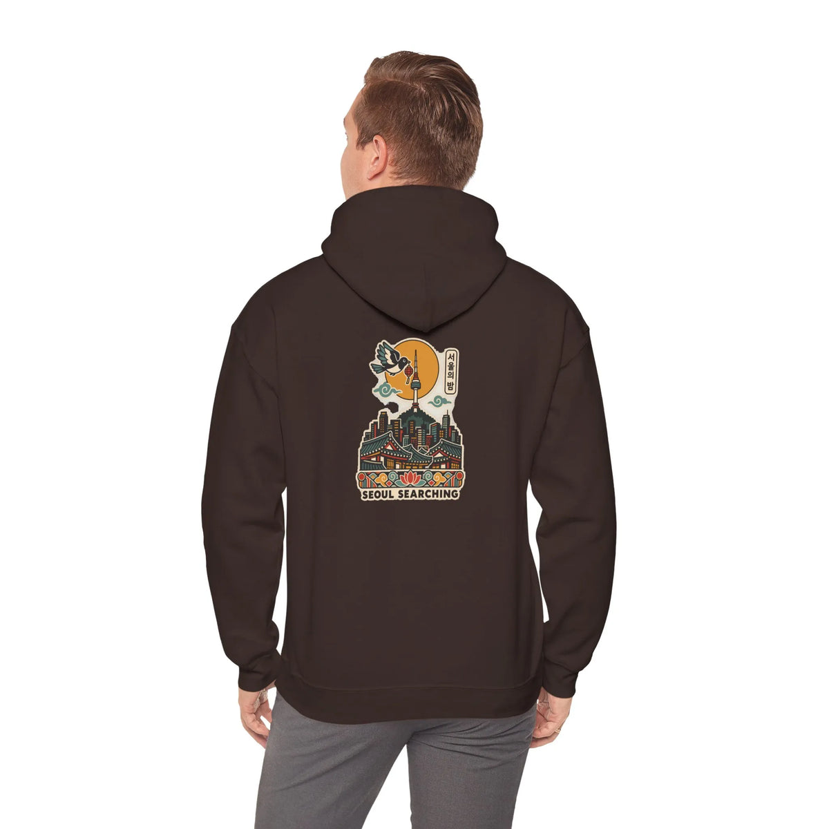 Back view of a coffee brown hoodie with a Seoul night skyline print, worn by a man