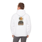 Back view of an off-white hoodie with a Seoul night skyline print, worn by a man