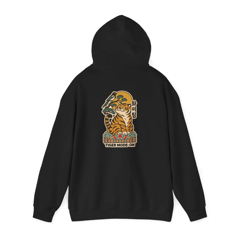 Black hoodie laid flat showing the tiger print on the back