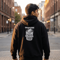 Model wearing Unsubscribe oversized hoodie, back print visible